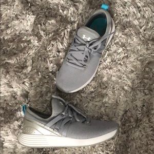 Under Armour silver and white women’s sneakers